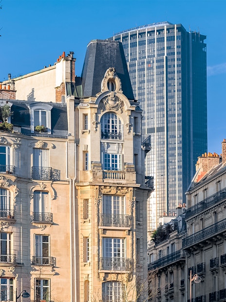 Historic Parisian buildings with Montparnasse Tower in the background.