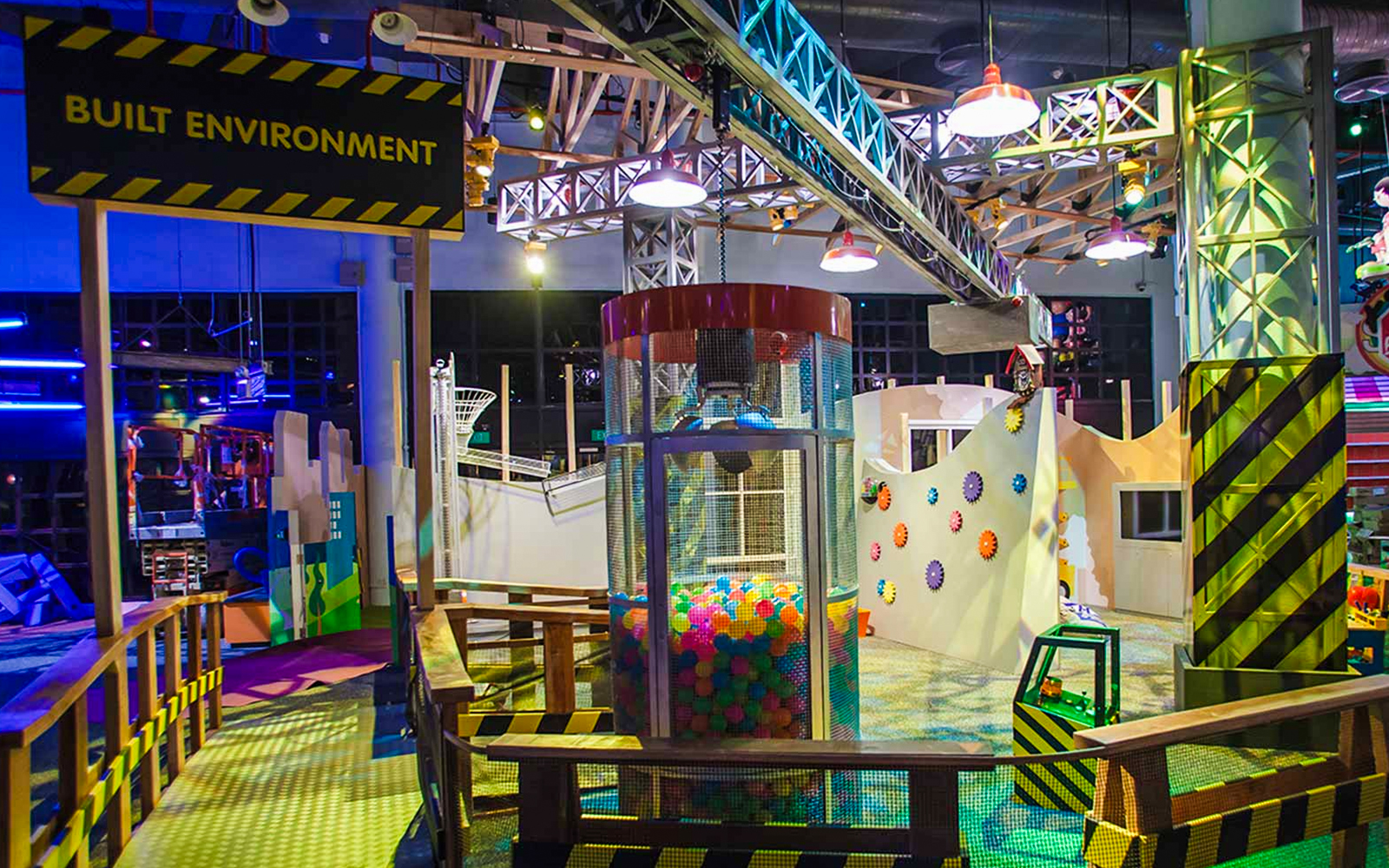 Interactive exhibit at Science Centre Singapore featuring colorful gears and play area.