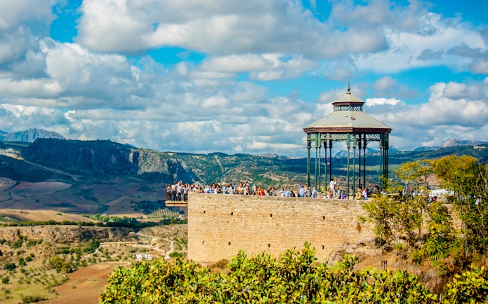 Gazebo at Alameda del Tajo park overlooking El Tajo gorge and Serranía de Ronda mountains, Ronda, Spain.