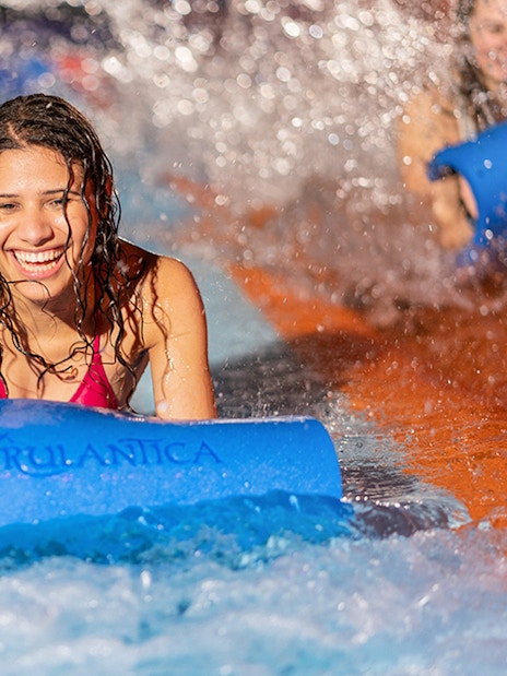 Person enjoying water slide at Rulantica water park.