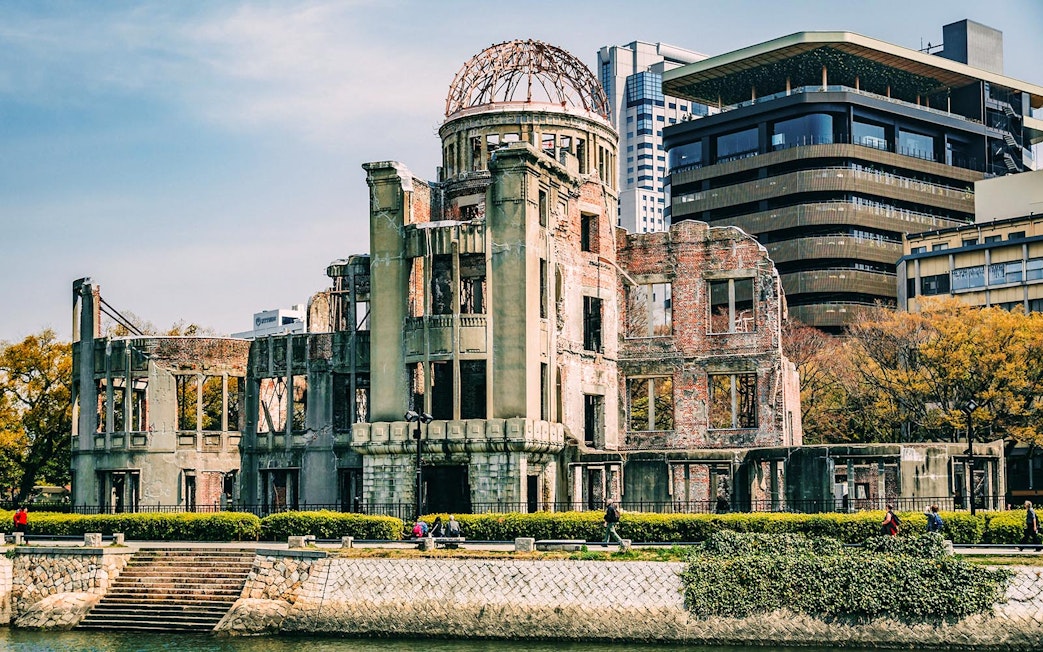 Hiroshima Peace Memorial Park Dome ruins with surrounding modern buildings.