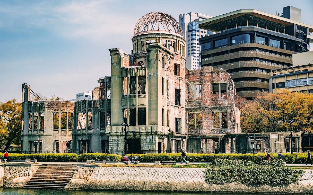 Hiroshima Peace Memorial Park Dome ruins with surrounding modern buildings.