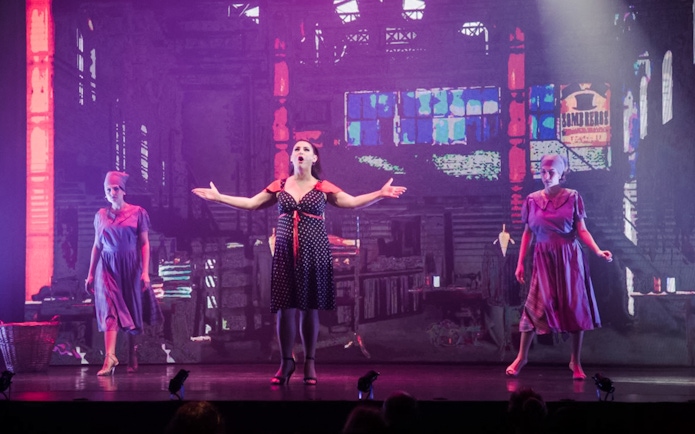 Performers on stage during Madero Tango Show in Buenos Aires.