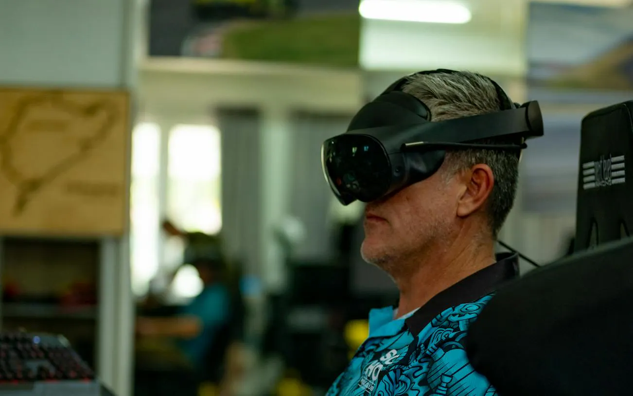 Man using VR headset for flight simulation at SIMPRO Academy, Phuket.