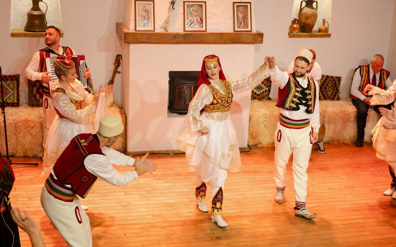 Artists performing traditional dance during Albanian Night Cultural Dance & Music Experience.