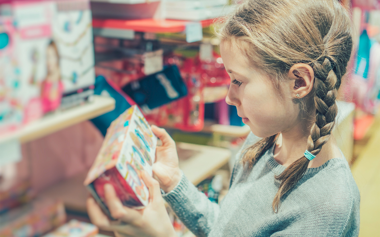 Child browsing toys in a London store.
