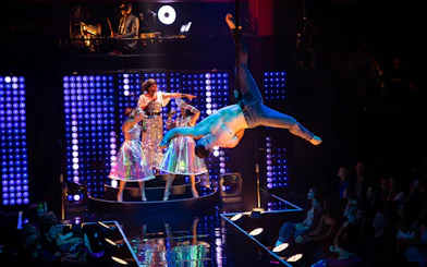 Aerial performer and singers on stage during Velvet Inferno show in Sydney.