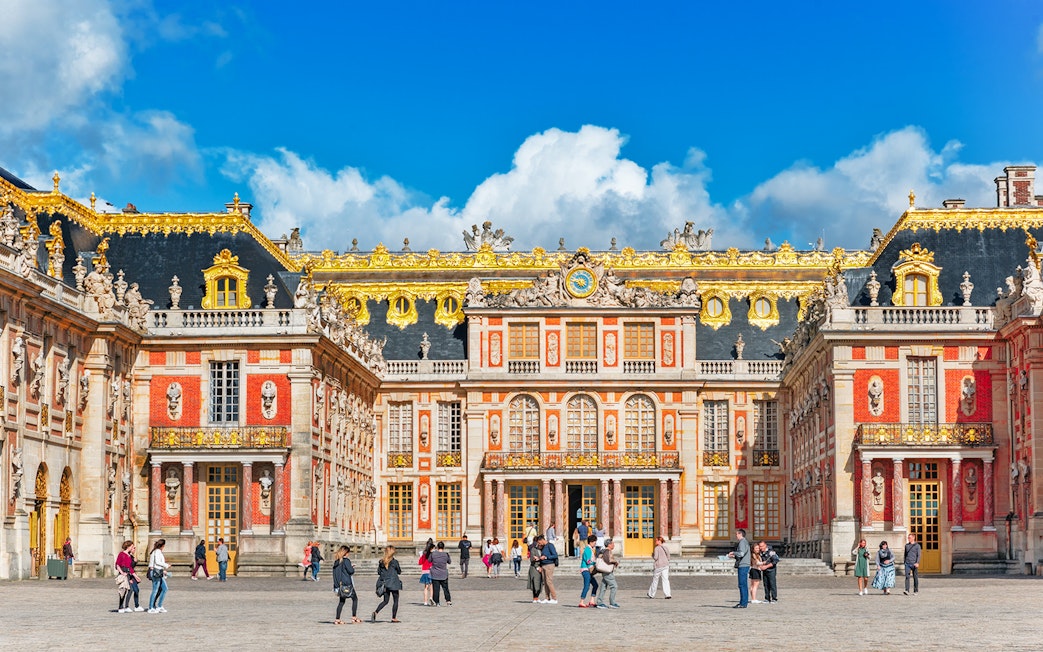 Palace of Versailles courtyard with visitors, Paris city pass tour.