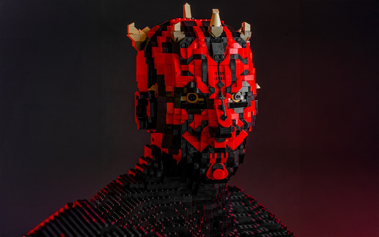 LEGO sculpture of a Star Wars character with red and black bricks at the exhibition.
