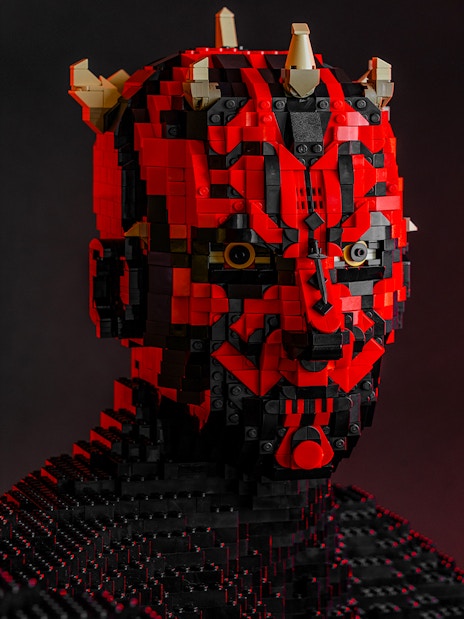 LEGO sculpture of a Star Wars character with red and black bricks at the exhibition.