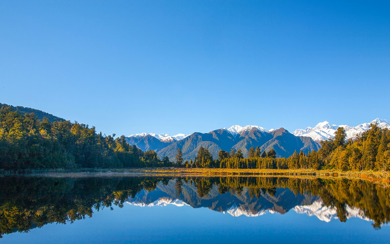 Lake Matheson with Southern Alps reflection, New Zealand.