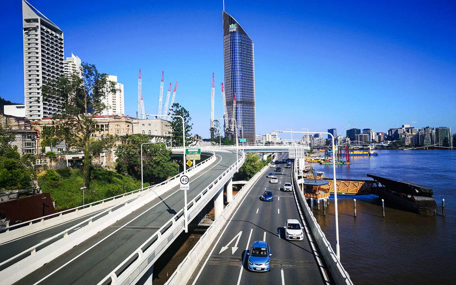 Pacific Motorway view with Brisbane skyline and river.