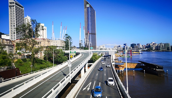 Pacific Motorway view with Brisbane skyline and river.