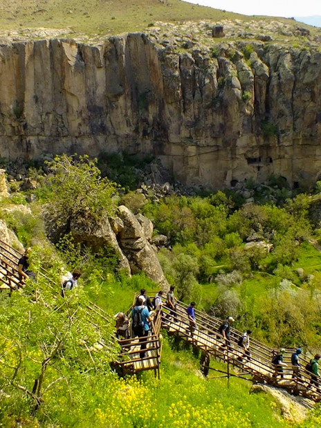 Visitors walking on a wooden path in Ihlara Valley, South Cappadocia.