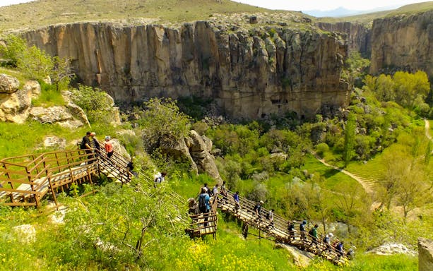 Visitors walking on a wooden path in Ihlara Valley, South Cappadocia.