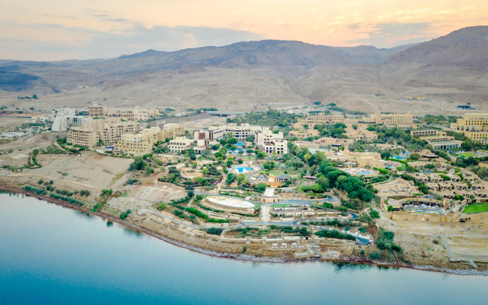 Aerial view of Jordan coastline with resorts and desert landscape.