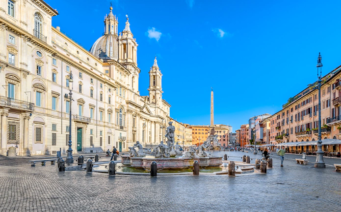 Piazza Navona in Rome featuring the Fountain of Neptune and surrounding architecture.