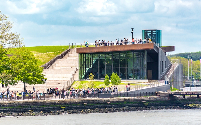 Visitors at Liberty Island with the Statue of Liberty Museum in New York City.