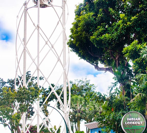 SkyHelix Sentosa ride at Imbiah Lookout, surrounded by lush greenery.