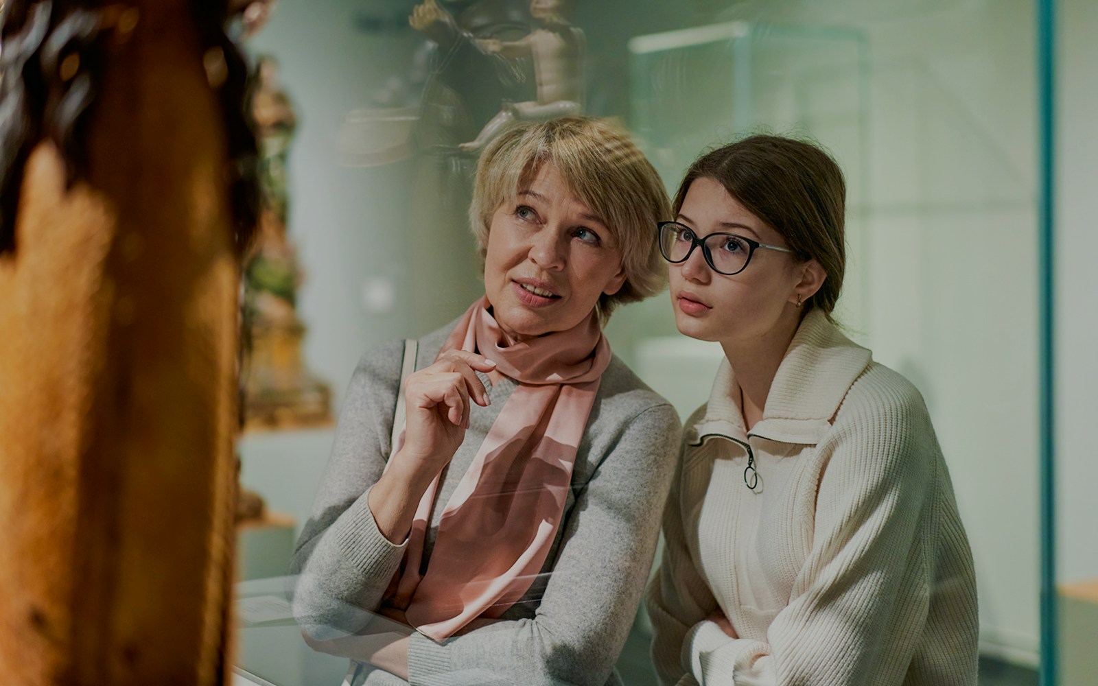 Woman and daughter observing exhibit at Archaeological Museum.