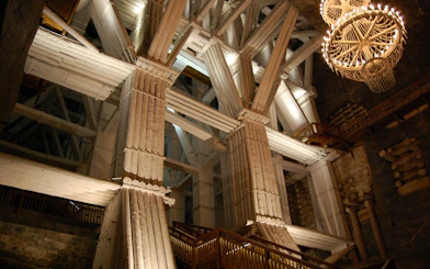 Wieliczka Salt Mine wooden structure and chandelier during guided tour from Krakow.