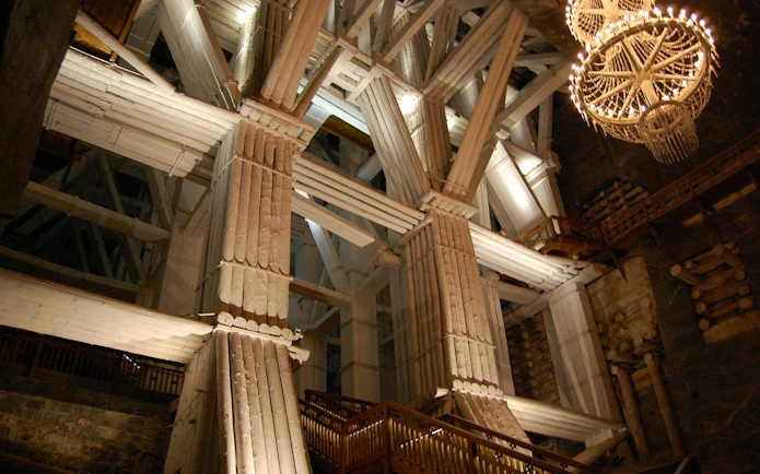 Wieliczka Salt Mine wooden structure and chandelier during guided tour from Krakow.