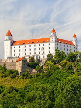 Bratislava Castle on a hill surrounded by greenery, Bratislava, Slovakia.