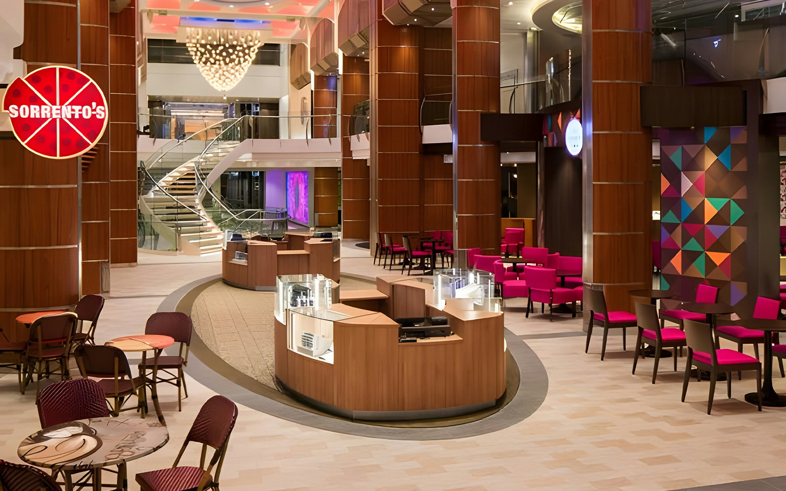 Interior view of Royal Caribbean cruise ship with dining area and seating arrangement.