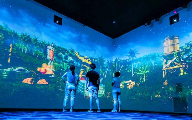 Projection mapping display of local legends in a multi-sensory experience, showcasing vibrant visuals.