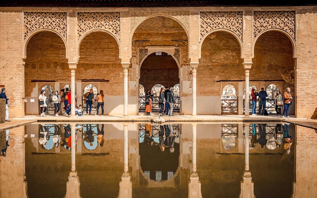 Palacio del Partal arches and reflection in Alhambra, Granada, Spain.