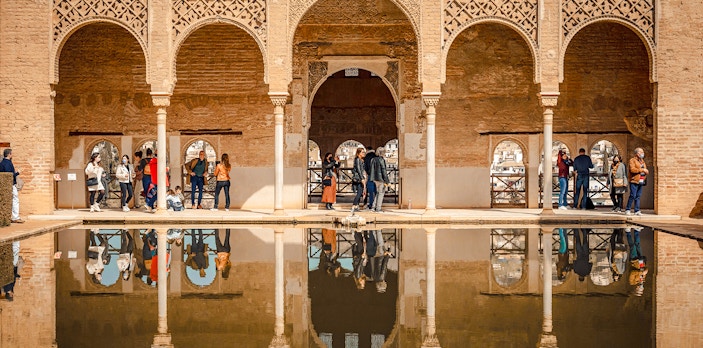 Palacio del Partal arches and reflection in Alhambra, Granada, Spain.