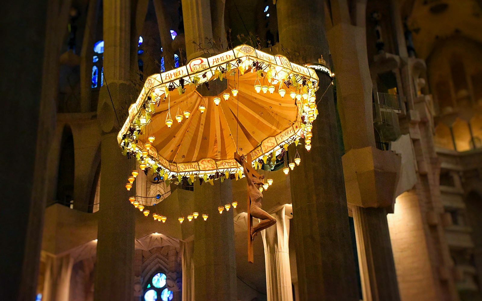 Sagrada Familia interior with intricate stained glass windows and towering columns in Barcelona, Spain.