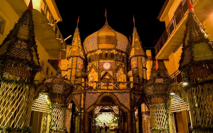 Archi di Pasqua festival structure illuminated at night in San Biagio Platani, Sicily.