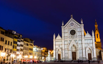 Santa Croce Basilica illuminated at night, Florence, Italy, seen during E-Bike Night Tour.