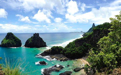 Coastal view of Fernando de Noronha with turquoise waters and rocky islets, Brazil.