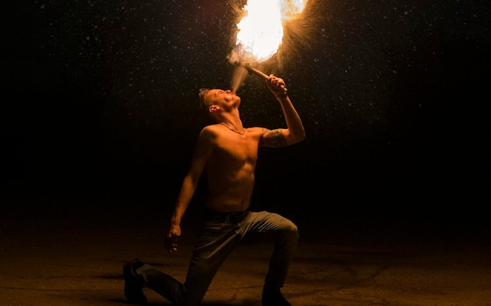 Fire performer at Night Splash event, SplashMania Waterpark.