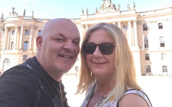 Couple in front of Berlin's historic Humboldt University building.