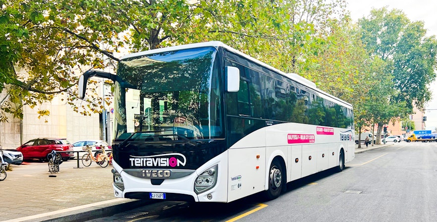 Terravision bus parked on a city street for Malpensa to Milan city center transfer.