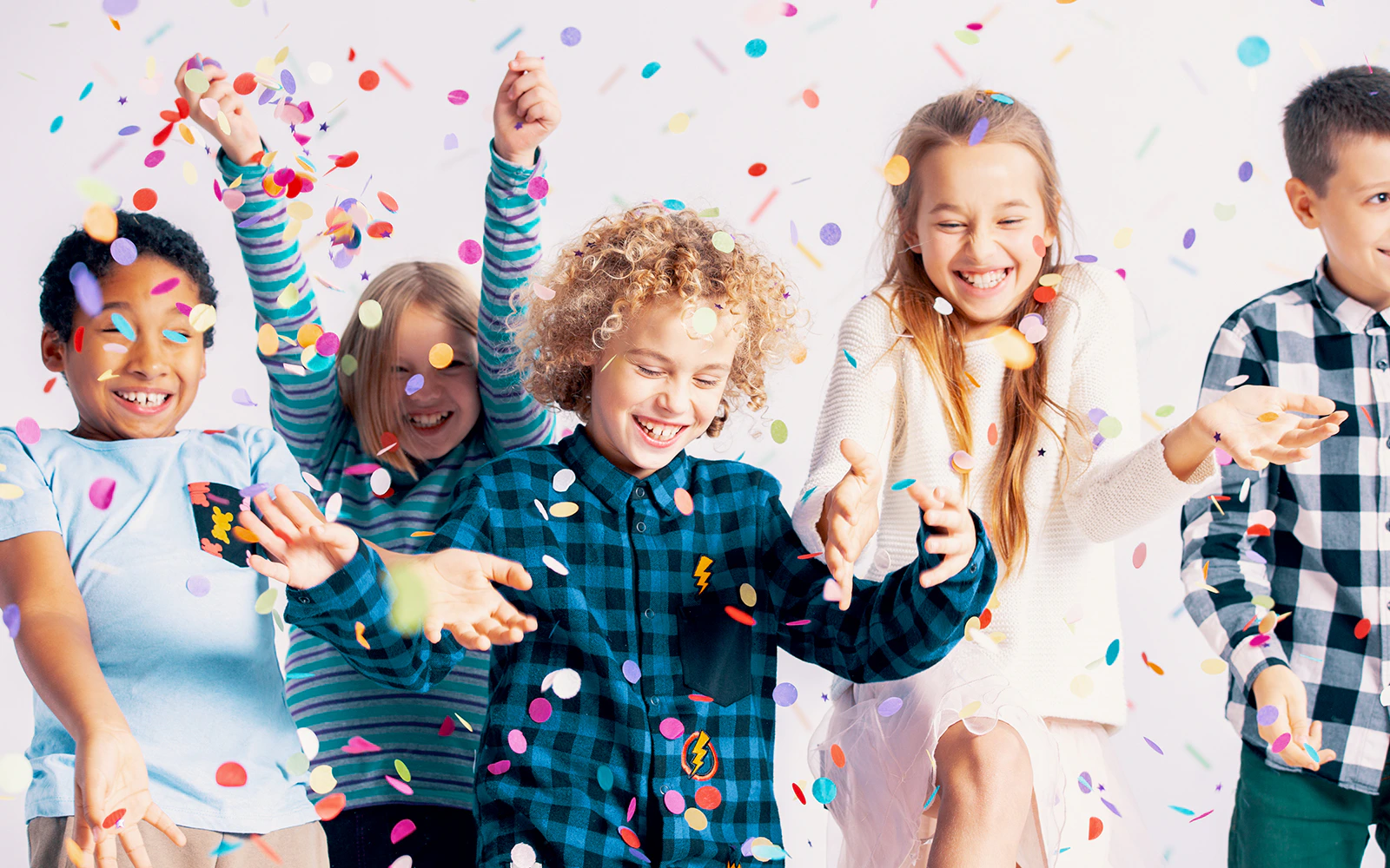 Children playing with confetti inside Burj Al Arab.