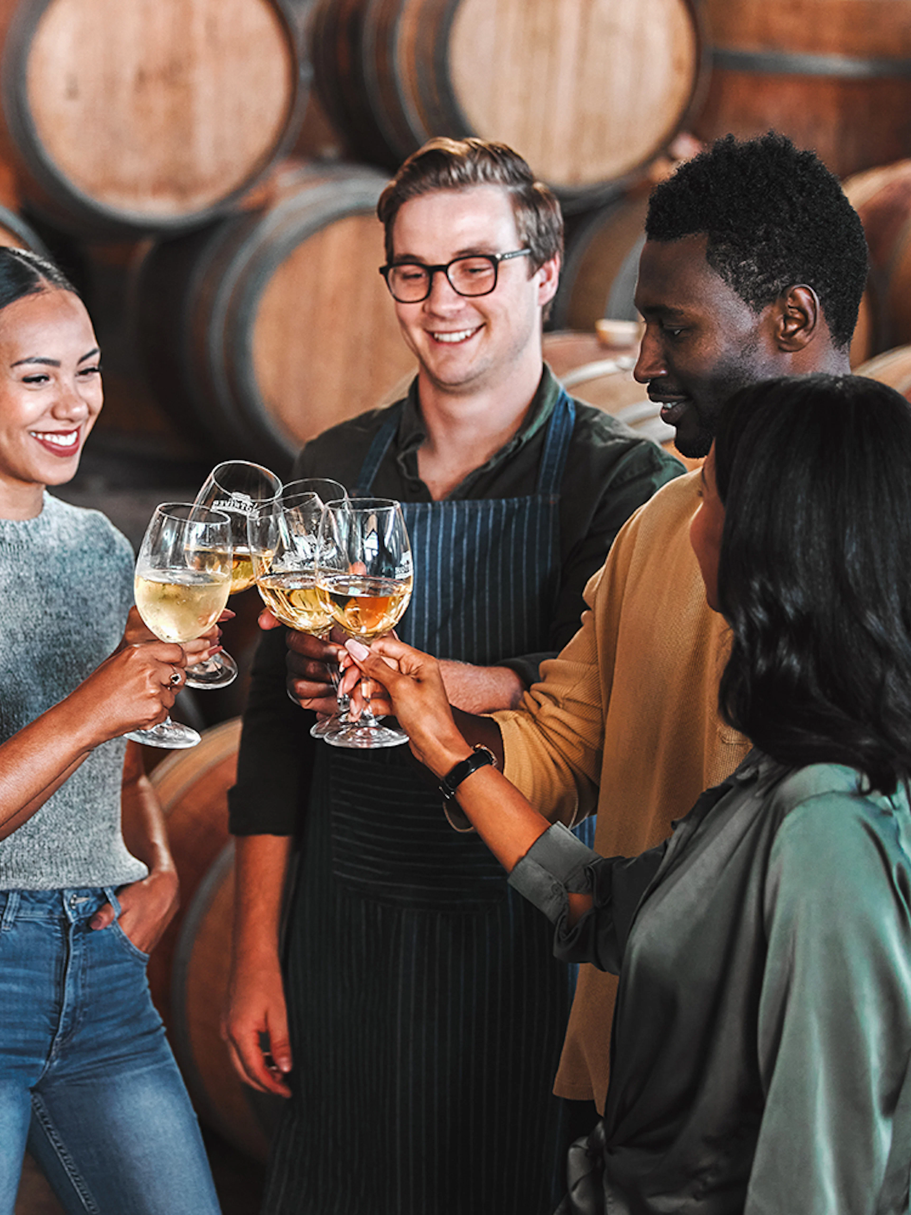 Visitors enjoying a wine tasting at Fonseca port wine cellar.