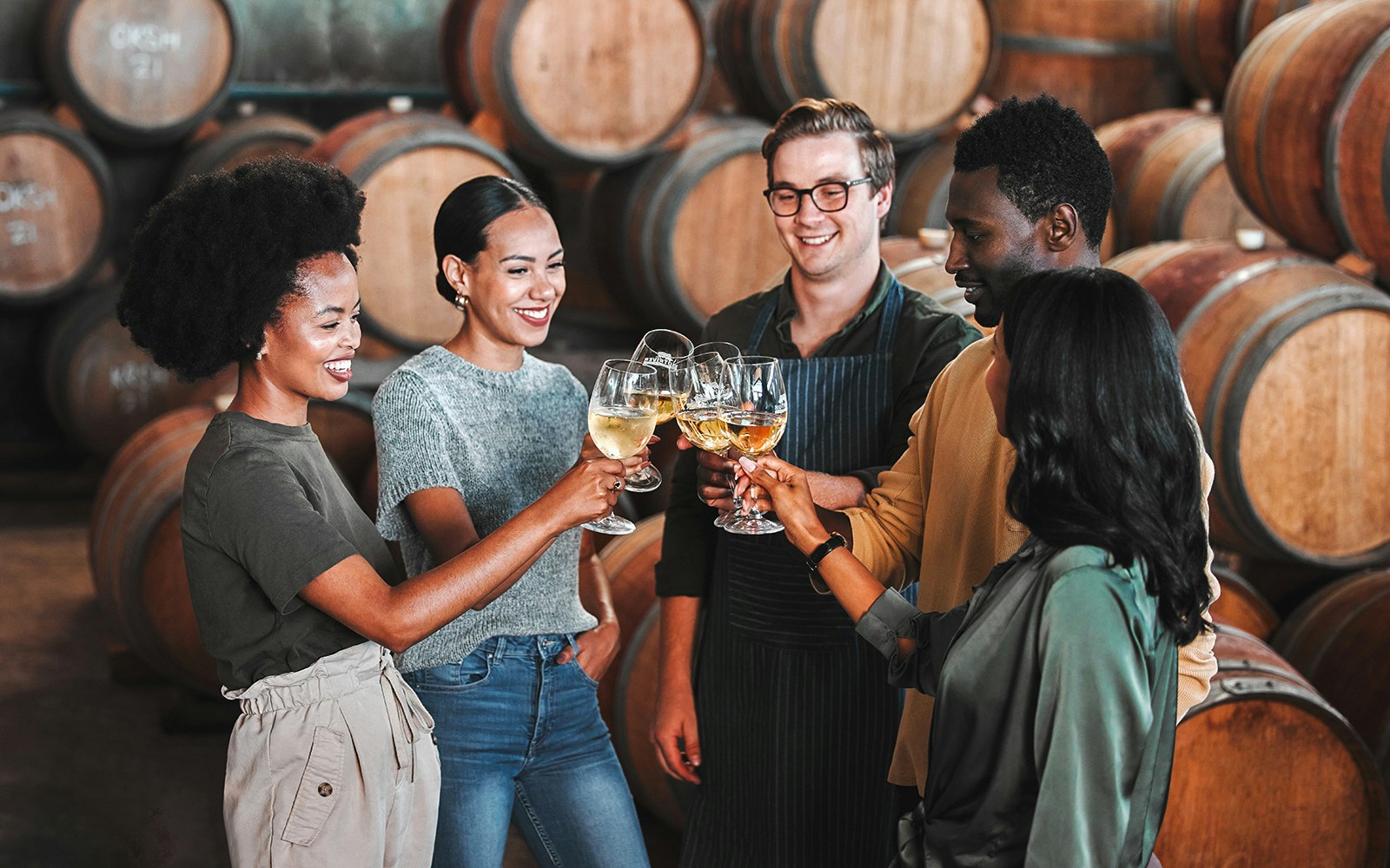 Visitors enjoying a wine tasting at Fonseca port wine cellar.