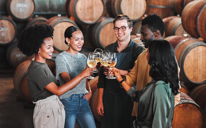 Visitors enjoying a wine tasting at Fonseca port wine cellar.