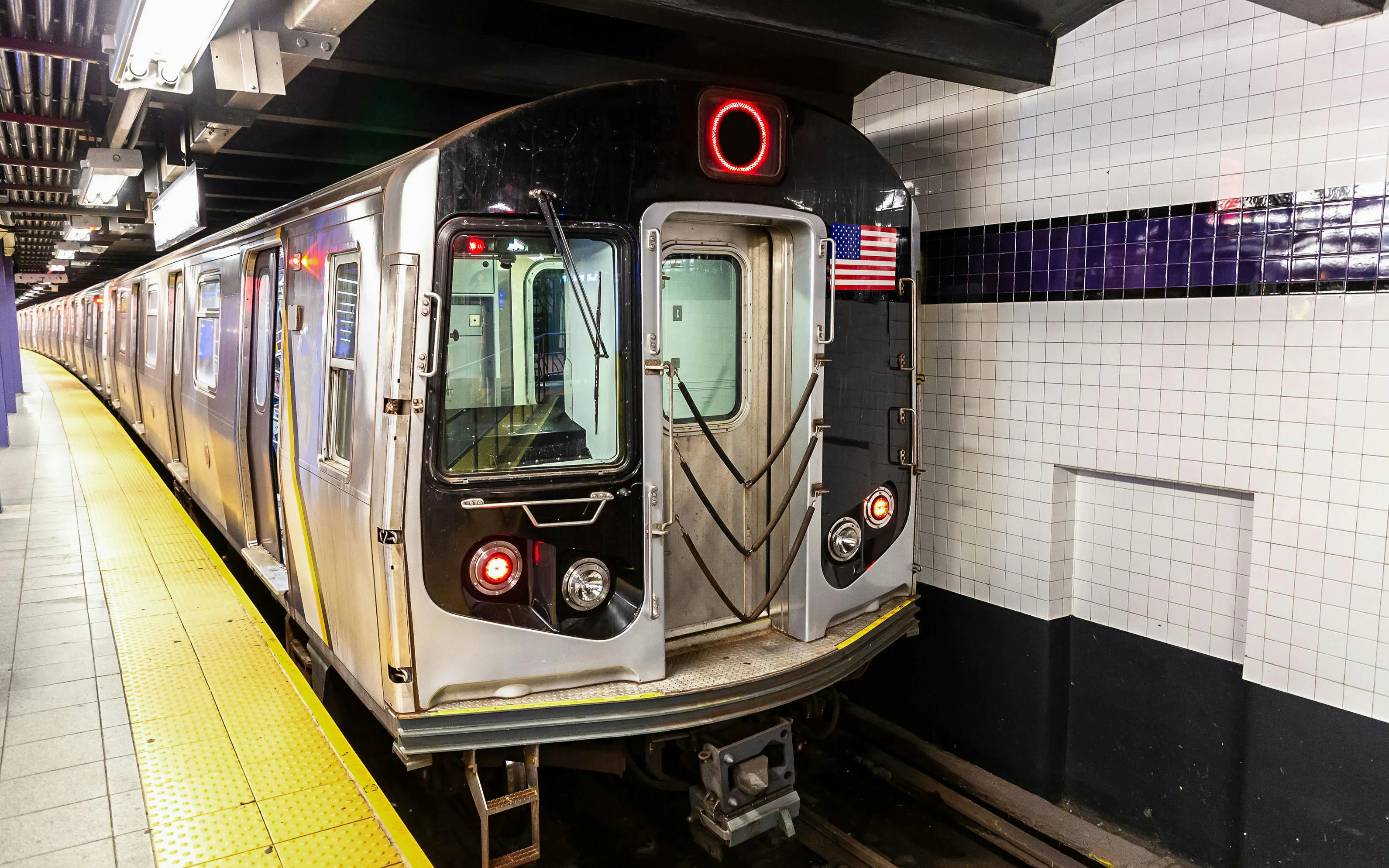 Subway train at a New York City station platform, Upper West Side.