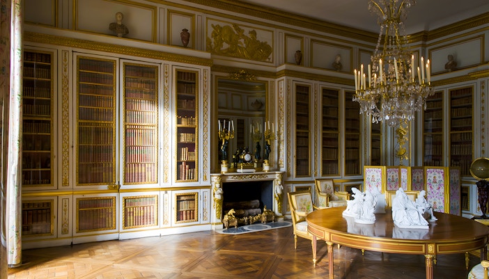 Louis XVI's Library in Versailles King's Private Apartment with ornate bookshelves and historical decor.