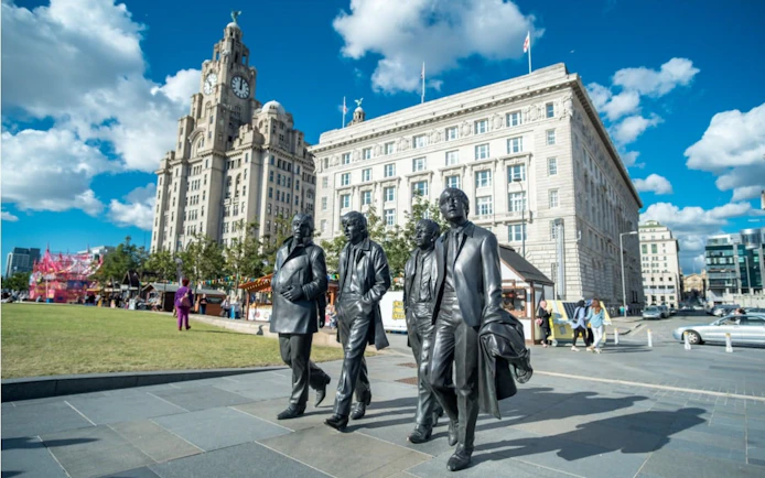 Statues of famous musicians in front of the Royal Liver Building, Liverpool.