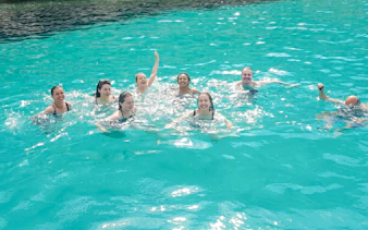 Group swimming in turquoise waters near Frioul Archipelago.