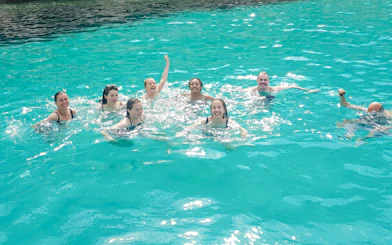 Group swimming in turquoise waters near Frioul Archipelago.