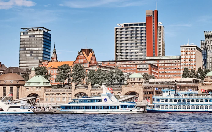 Hamburg Port with boats and city skyline in the background.