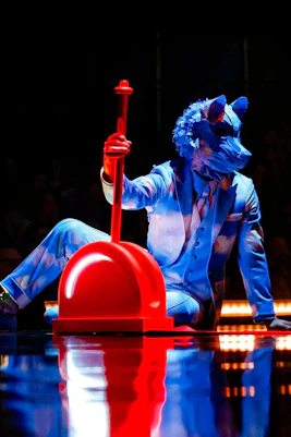 Performer in blue costume with animal mask at Cirque Du Soleil ECHO show.