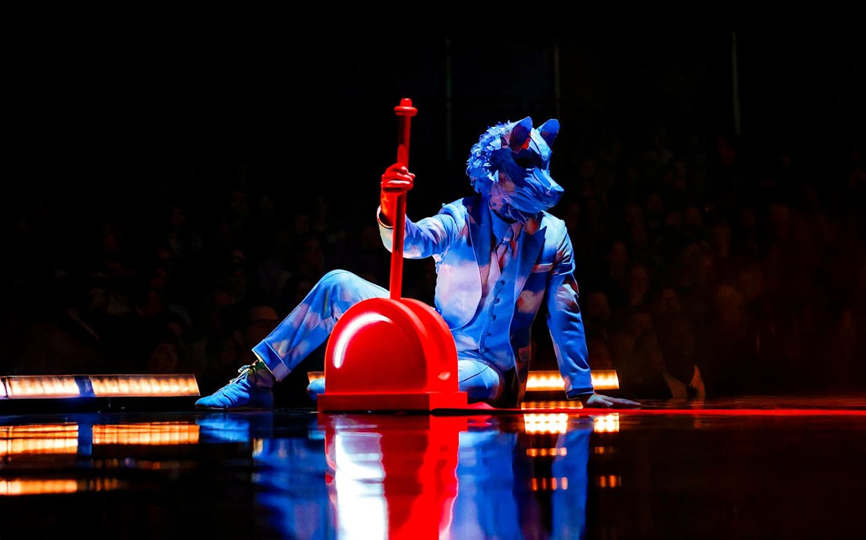 Performer in blue costume with animal mask at Cirque Du Soleil ECHO show.